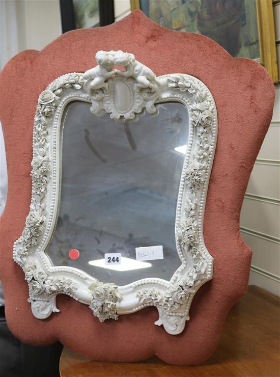 A German porcelain mirror length 67cm approx.